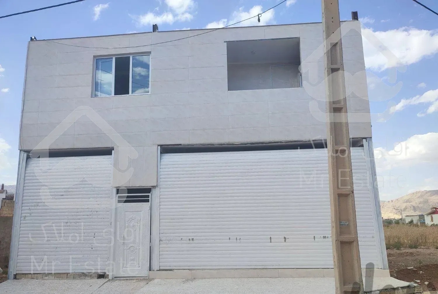 ساختمان دوطبقه تجاری مسکونی تلوری خ اصلی گلها