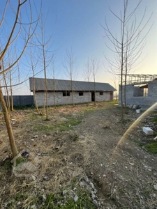 زمین مسکونی با دو اتاق و صدمتر انباری