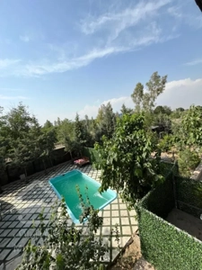 زمین ۱۱۰۰ متری شهرکی با استخر احمدآباد مستوفی